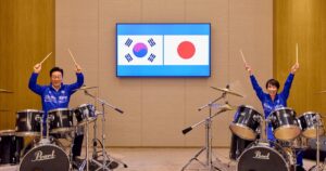 Japan, South Korea leaders drum up viral moment with K-pop jam