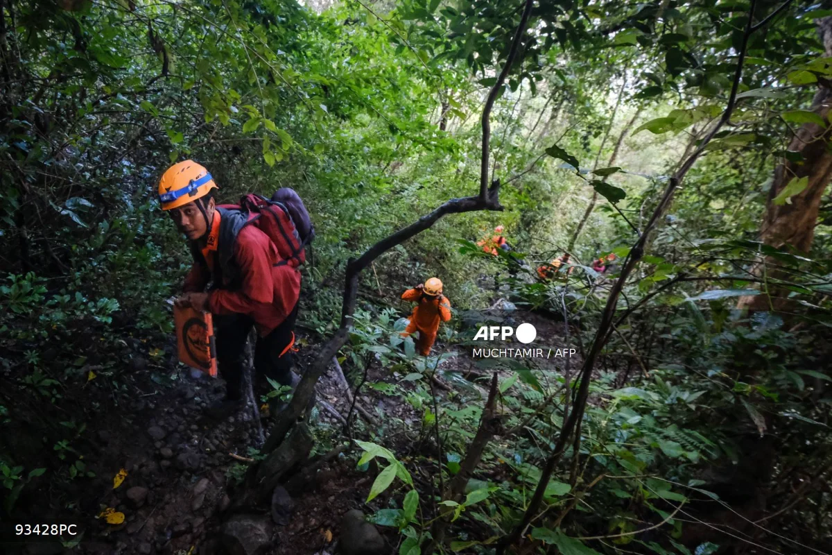 Rescuers find body and debris from Indonesia plane crash with 10 onboard
