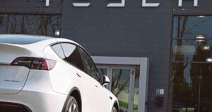 Tesla profits tumble on lower EV sales, AI spending surge