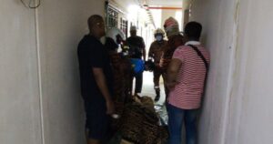 Firefighters assist police in removing body of 200kg man from 14th floor