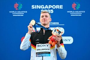 Florian Wellbrock claims world 10km swim gold after water delay in Singapore
