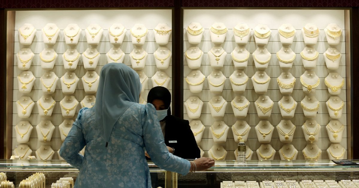 Gold dips as dollar firms, Trump's Powell remarks ease market jitters