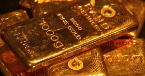 Gold falls as trade tensions soften, US data on tap