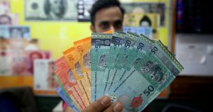 Ringgit ends lower as greenback gains on hopes of easing trade war