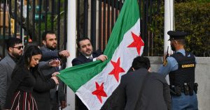 Syrian foreign minister raises new flag at UN headquarters