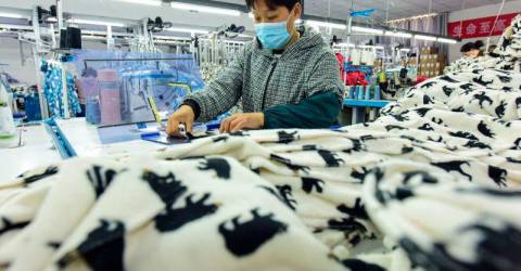 China says 'door open' to trade talks after Trump signals tariffs will fall